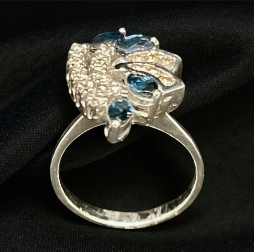 Elegant ring featuring 18-carat white gold, blue sapphires, and diamonds