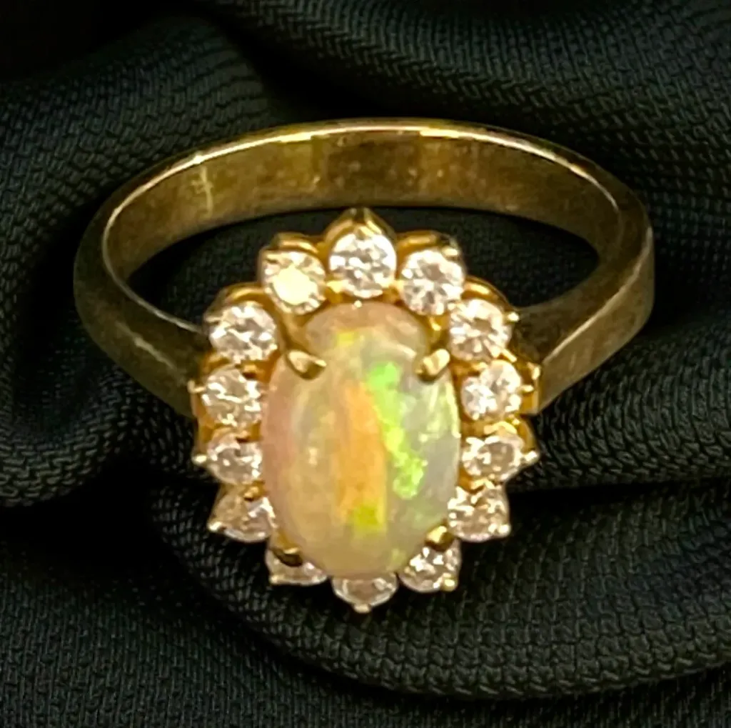 A 22-carat yellow Gold, Opal and Diamond ring