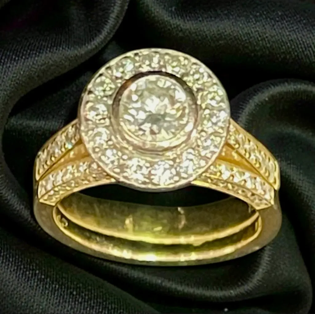An 18-carat yellow and white Gold ninety nine (99) stone ring