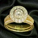 An 18-carat yellow and white Gold ninety nine (99) stone ring