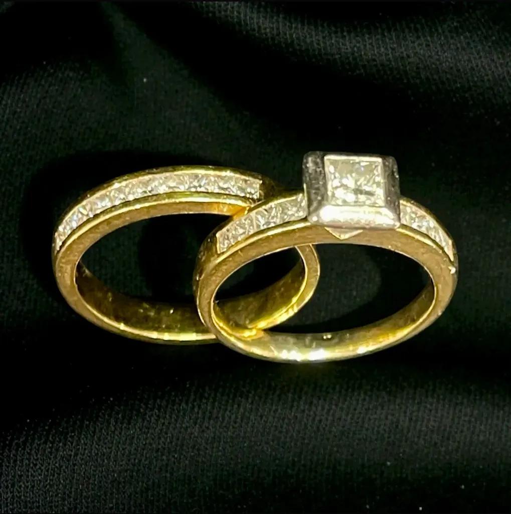 An 18-carat yellow and white Gold handmade wedding set consisting of a nine (9) stone Diamond ring