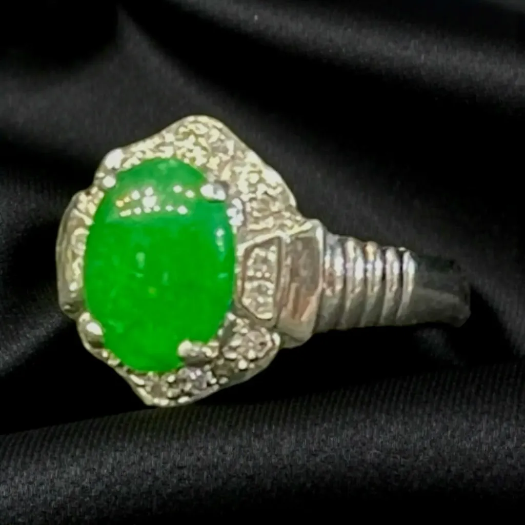 A Platinum, Jade and Diamond ring