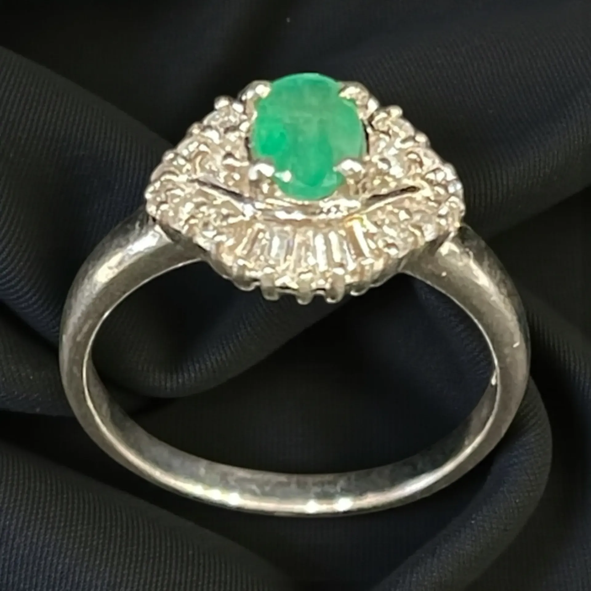 A Platinum (900). Emerald and Diamond dress ring