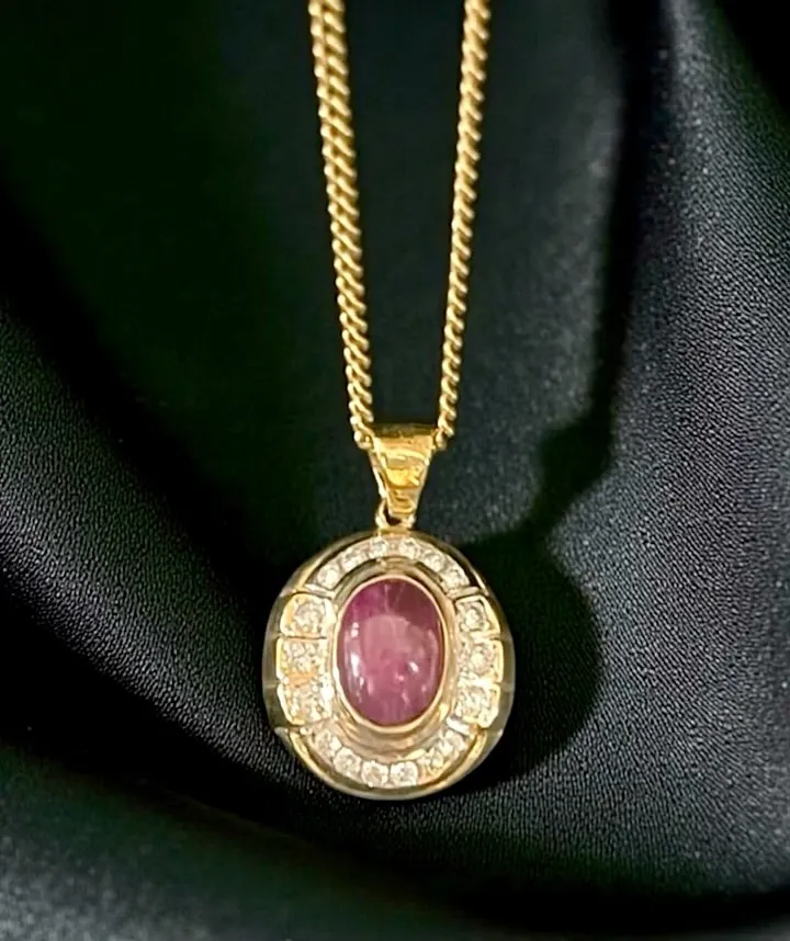 An 18-carat yellow Gold, Ruby and Diamond pendant