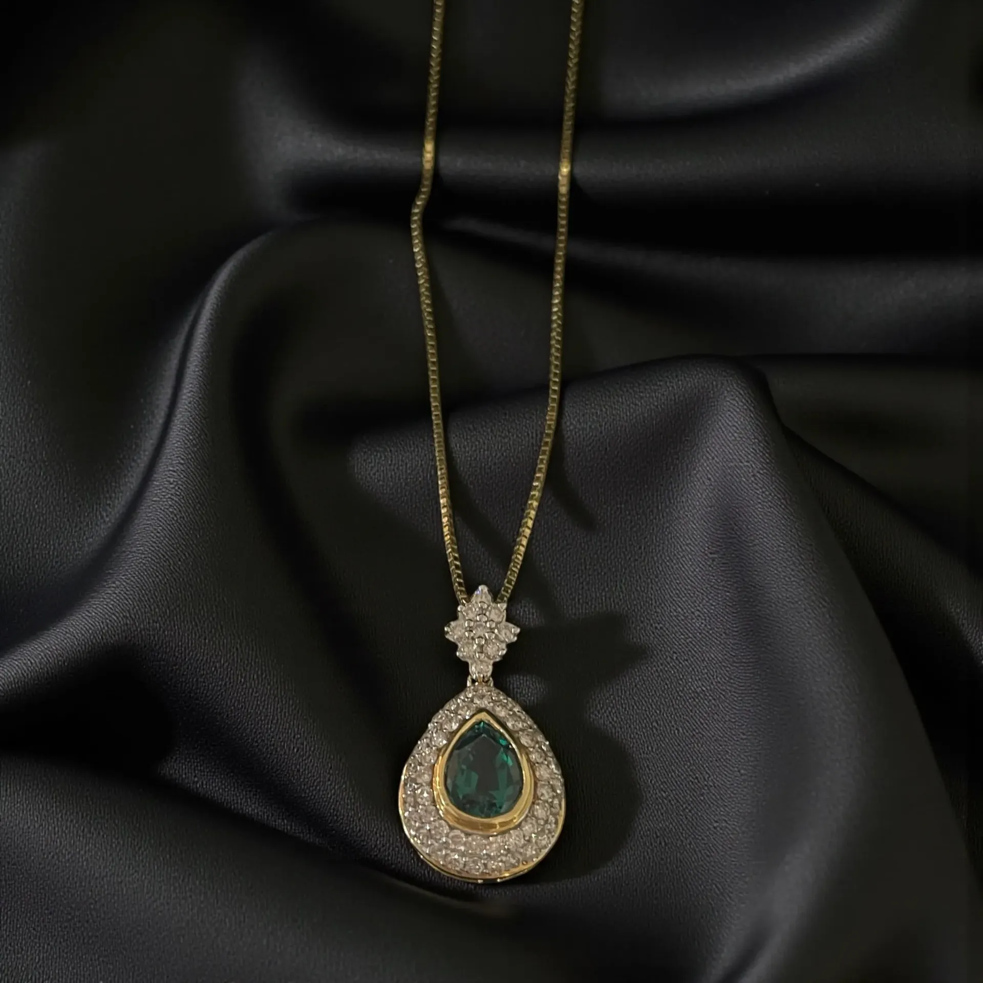 An 18-carat yellow Gold, Emerald and Diamond pendant